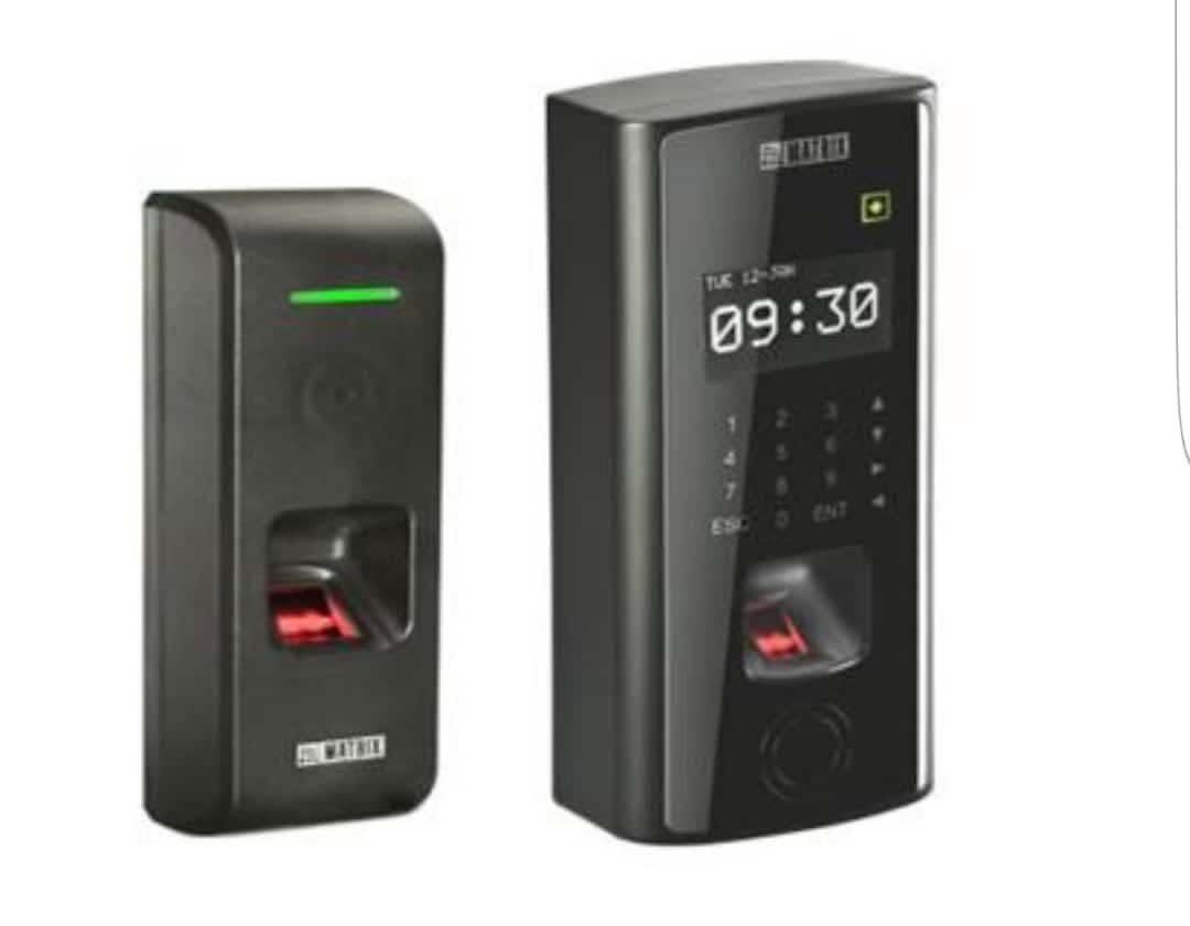 Fingerprint readers and a keypad attendance terminal installed at controlled entry points.